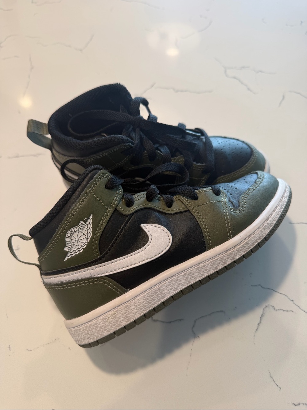 Kids Olive Green and Black High-Top Nike Sneakers with White Swoosh